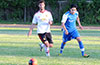 Marciel Correa of Bateman Painting(left) and Rodolfo Marin of Tortorella Pools racing toward the ball