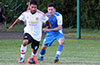 Tono Gonzalez of Bateman Painting holding the ball away from Stiven Orrego of Tortorella Pools