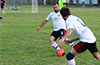 Jorge Castano of Bateman Painting passing the ball to Rafael Santos