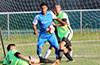 Diego Guazhambo of Tortorella Pools(center) shocked that Diego Villacona of FC Tuxpan on the ground will kick the ball