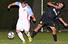Alex Juniors of Sag Harbor(left) moving the ball past Gehider Garcia of Hampton FC