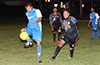 Cristian Munoz of Tortorella Pools trapping the ball in front of Nicolas Gomez of Hampton FC