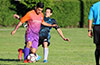 Jose Gutierrez of FC Tuxpan trying to dribble around Romulo Tubatan of Bateman Painting
