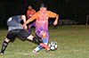 Luis Munoz of FC Tuxpan dribbling past a Hampton FC player
