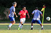 Jeremias Simon of Sag Harbor(center) being guarded by Fabian Arias(left) and Oscar Reinoso of Hampton FC