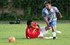 Oscar Reinoso of Hampton FC dribbling over Roberto Meza of Sag Harbor