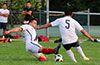 Andres Flores of Hampton Construction sliding for the ball