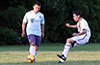 Christian Neira of FC Tuxpan(left) holding the ball away from Cristian Baros of Hampton Construction