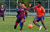 Julian Barahona of Maidstone Market(left) and Mouhamadou Gaye of EH Soccer Fever, racing toward the ball