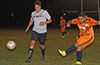 Cristian Compuzano of FC Tuxpan(right) hitting the ball past Sebastian Kruly of East Hampton