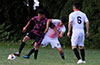 Eddy Juarez of FC Tuxpan(left) holding off Lenis Vera of FC Palora