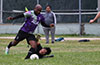 Liga de Gulag goalie, Edgar Farez, trying to steal the ball from Malher Baldrich of Maidstone Market
