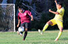 Gustavo Gutama of East Hampton SC(left) blasting the ball past Dany Velasquez of FC Tuxpan