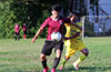 William Solis of East Hampton SC protecting the ball from Dany Velasquez of FC Tuxpan