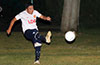 Adrian Rojas of Liga de Gulag blasting the ball up the field