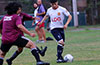 Santiago Solis of Liga de Gulag(right) protecting the ball
