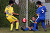 Tortorella Pools goalie, Alejandro Bolanos, sliding to prevent the shot by Jean Paul Palacios of FC Tuxpan