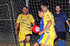 Romulo Tubatan of Tortorella Pools(blue) surrounded by Cristian Compuzano and Jorge Neito of FC Tuxpan
